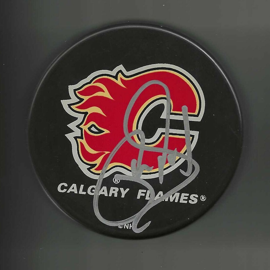 Phil Housley Signed Calgary Flames Souvenir Puck