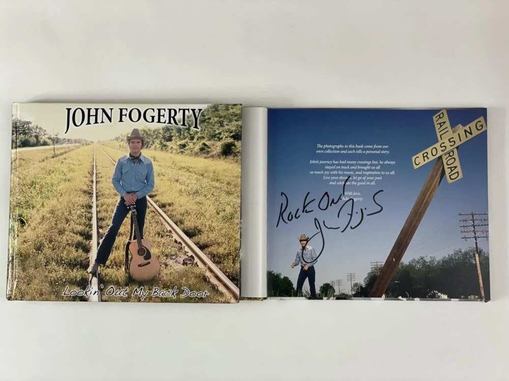 JOHN FOGERTY AUTOGRAPH LOOKIN OUT MY BACK DOOR BOOK CREEDENCE CLEARWATER REVIVAL