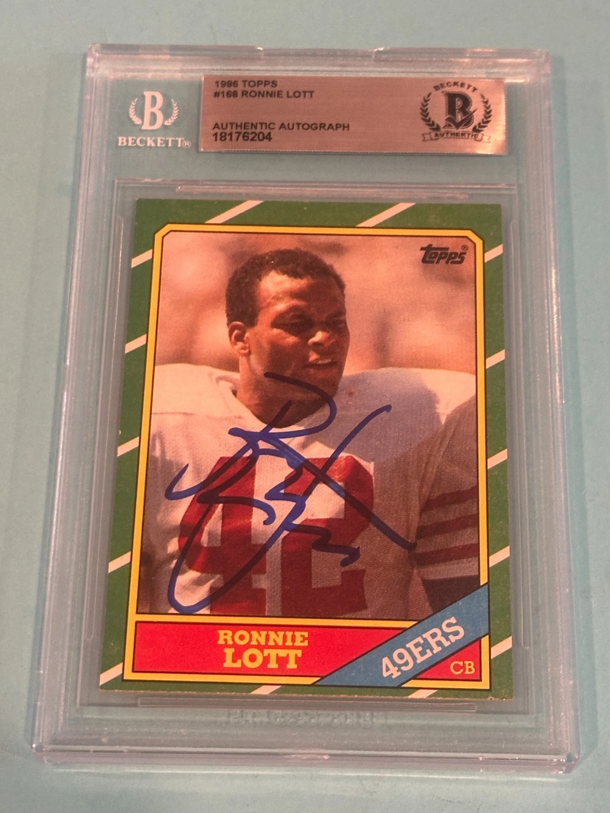 RONNIE LOTT Signed 1986 TOPPS Card #168 Beckett Authenticated (BAS)