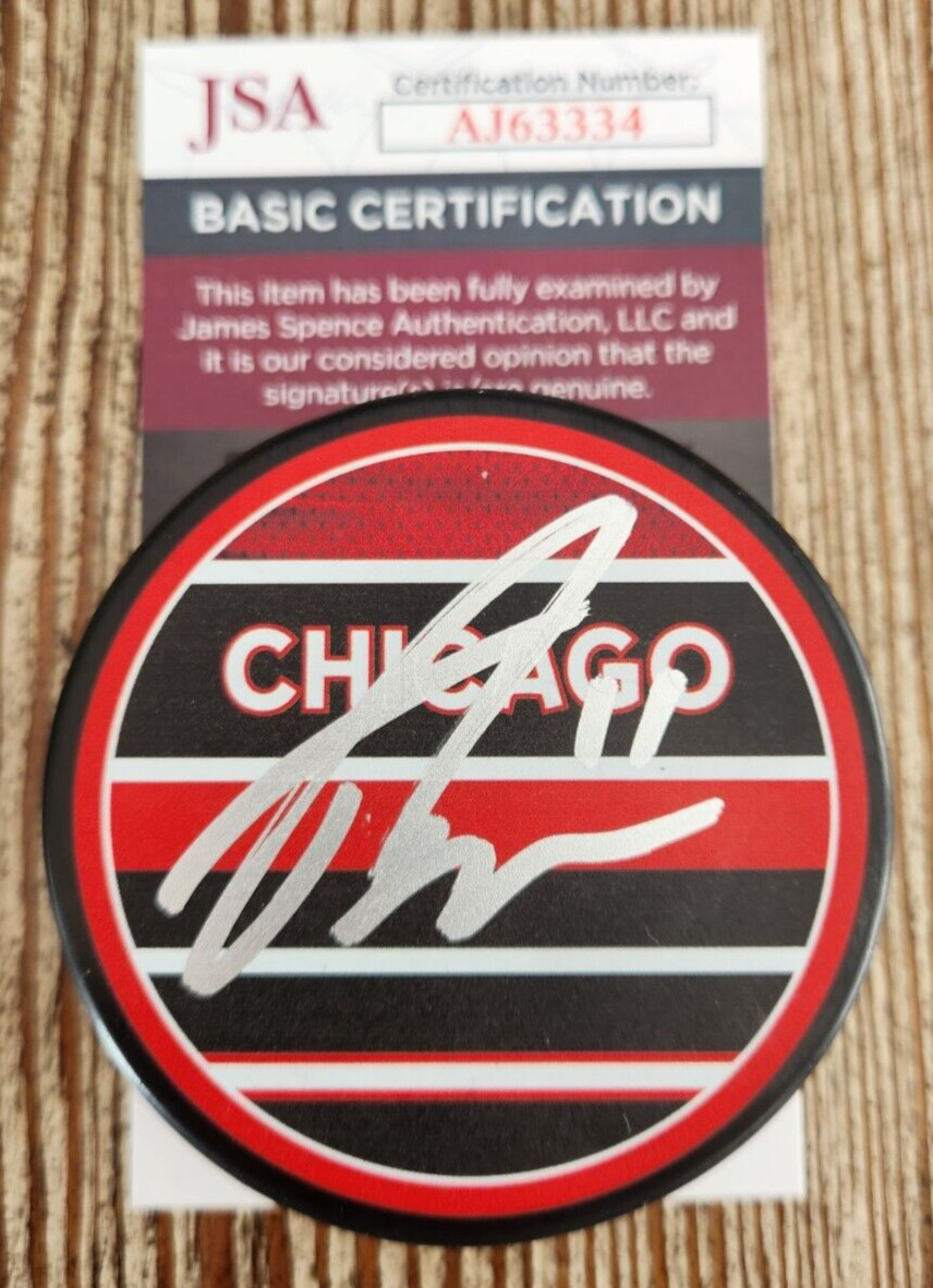 Taylor Raddysh Signed Reverse Retro Puck w/ JSA COA #AJ63334 Chicago Blackhawks