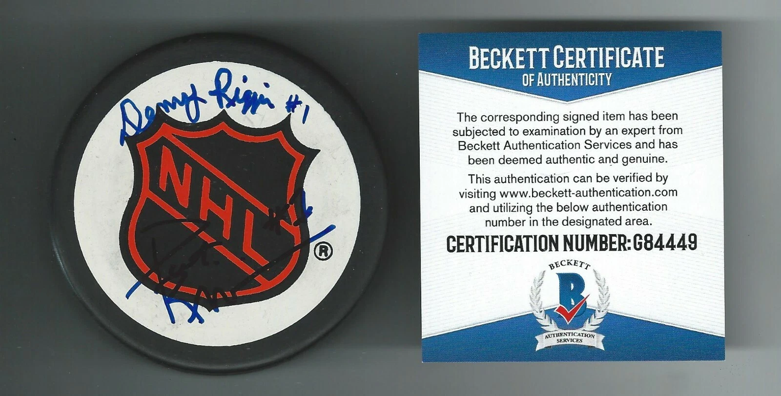 Dennis & Pat Riggin Signed NHL Shield Puck Beckett COA Red Wings Capitals WHA