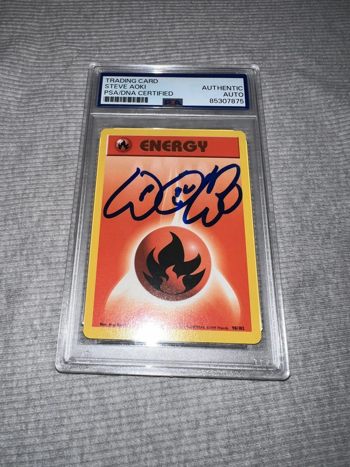 Steve Aoki Signed Official Pokemon Trading Card 99 Base Unlimited Fire PSA/DNA