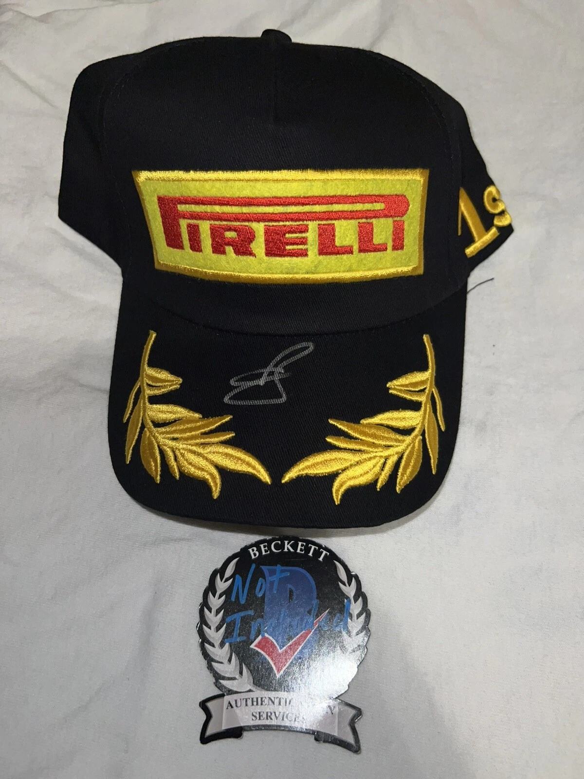 Oliver Bearman Signed Pirelli Podium Hat F1 Star Ferrari Haas Rookie Beckett #2