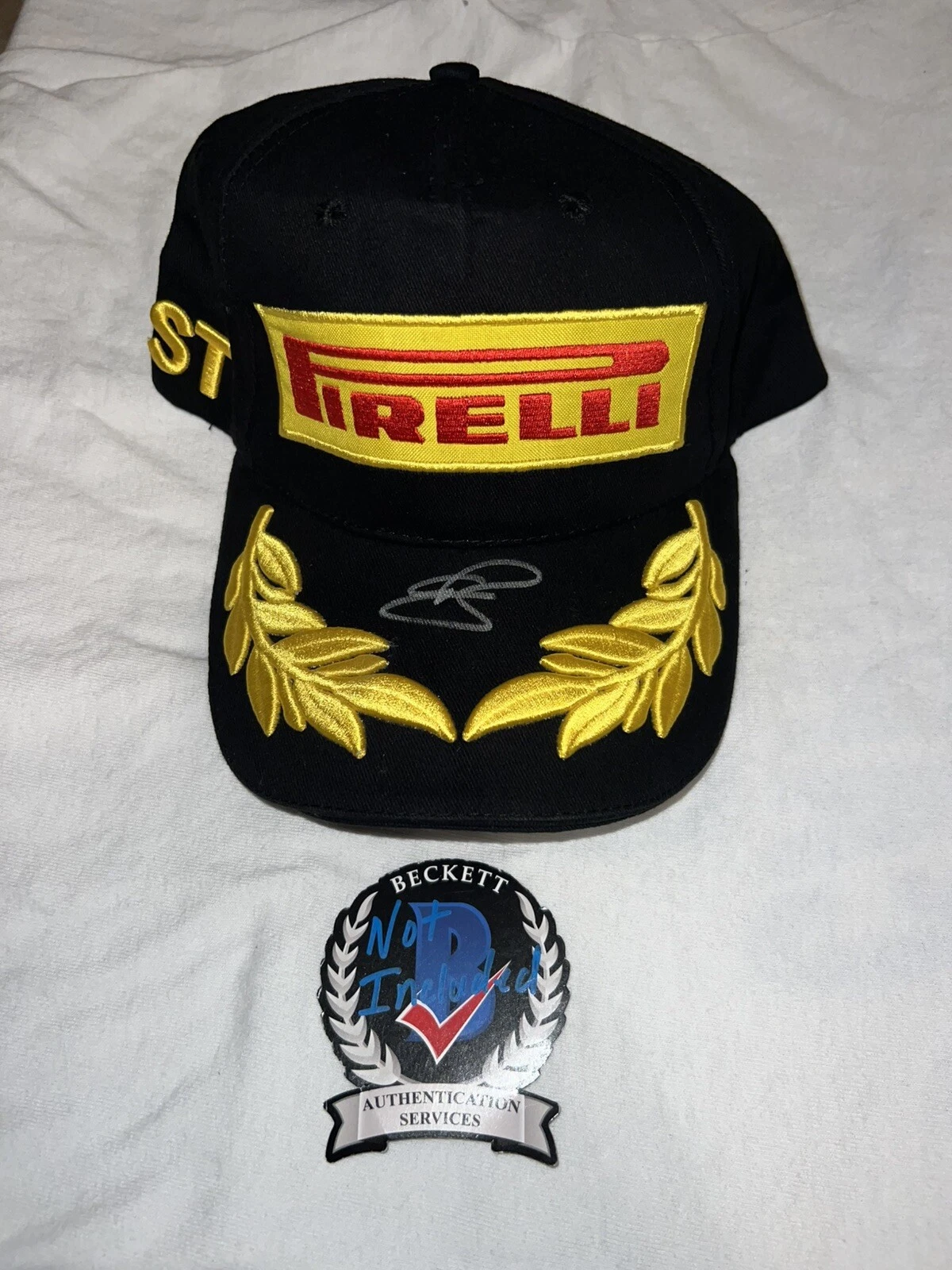 Oliver Bearman Signed Pirelli Podium Hat F1 Star Ferrari Haas Rookie Beckett #3