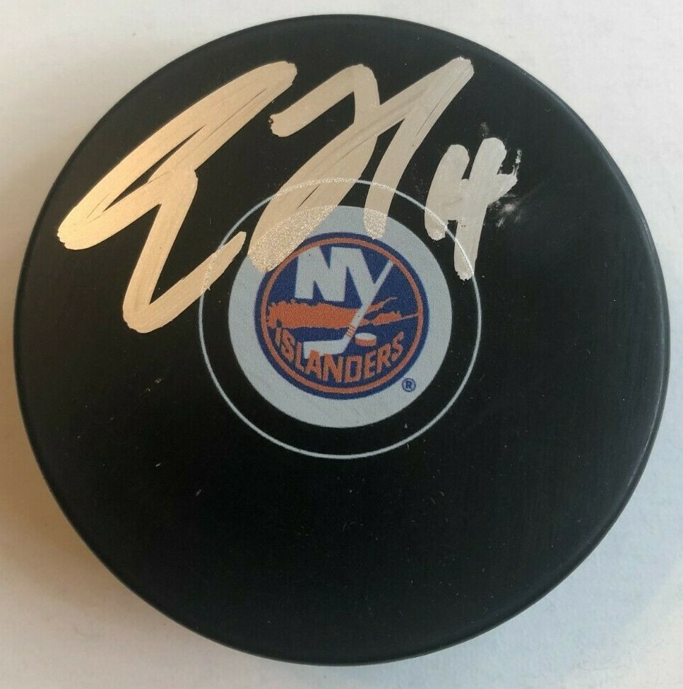 TRAVIS ZAJAC SIGNED NEW YORK ISLANDERS HOCKEY PUCK W/ CASE COA