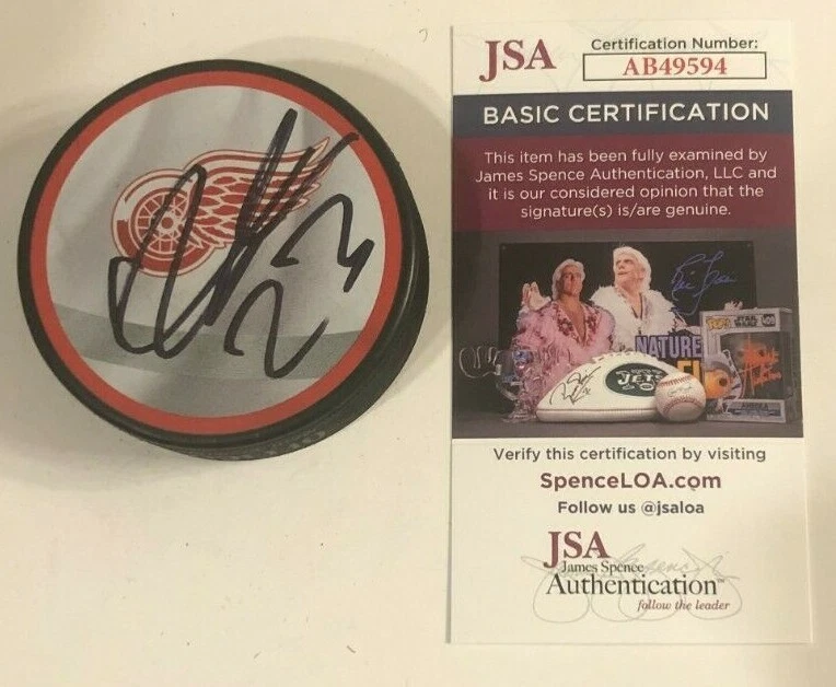 LUCAS RAYMOND SIGNED DETROIT RED WINGS HOCKEY PUCK W/ CASE JSA COA
