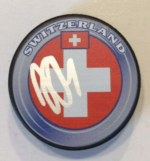JJ MOSER SIGNED SWITZERLAND HOCKEY PUCK W/ CASE ARIZONA COYOTES COA