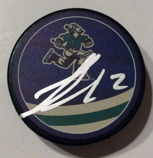 LUKE SCHENN SIGNED VANCOUVER CANUCKS REVERSE RETRO HOCKEY PUCK W/ CASE COA