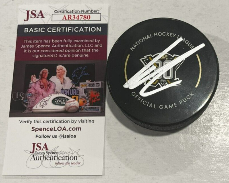 LEO CARLSSON SIGNED ANAHEIM DUCKS OFFICIAL GAME HOCKEY PUCK W/ CASE JSA COA