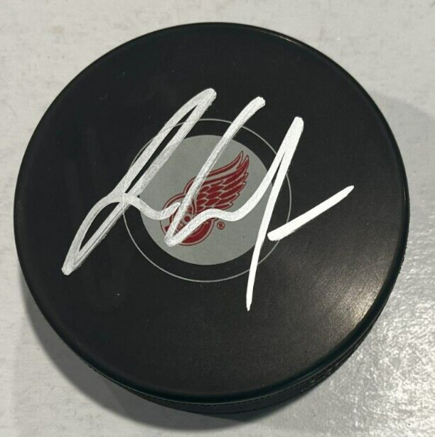 JT COMPHER SIGNED DETROIT RED WINGS HOCKEY PUCK W/ CASE COA