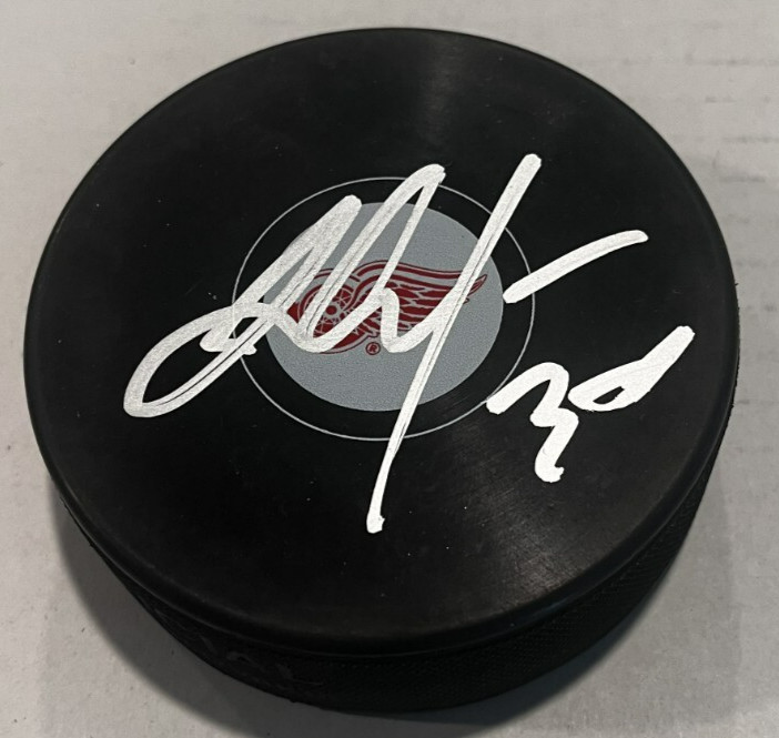 JT COMPHER SIGNED DETROIT RED WINGS HOCKEY PUCK W/ CASE COA