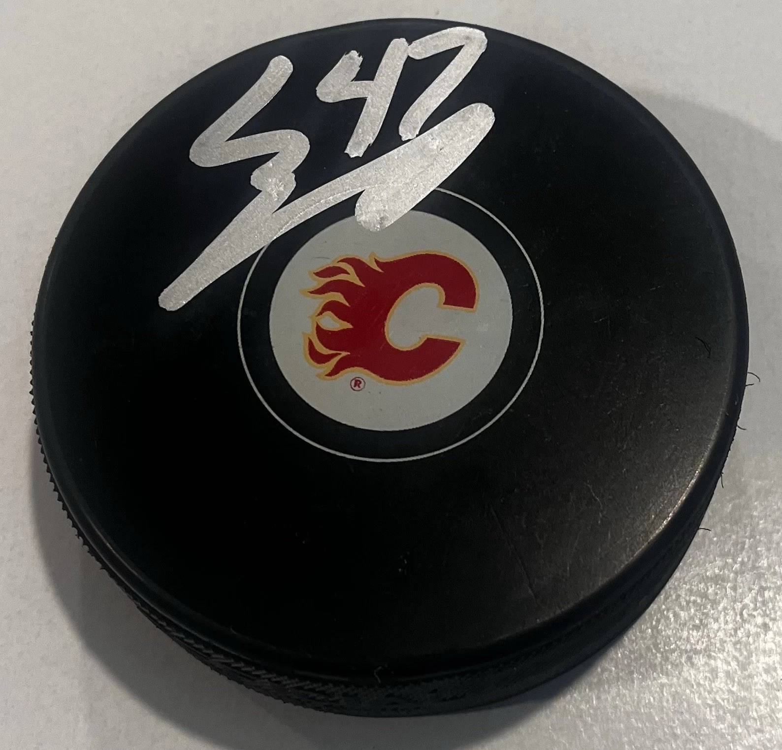 CONNOR ZARY SIGNED CALGARY FLAMES HOCKEY PUCK W/ CASE COA