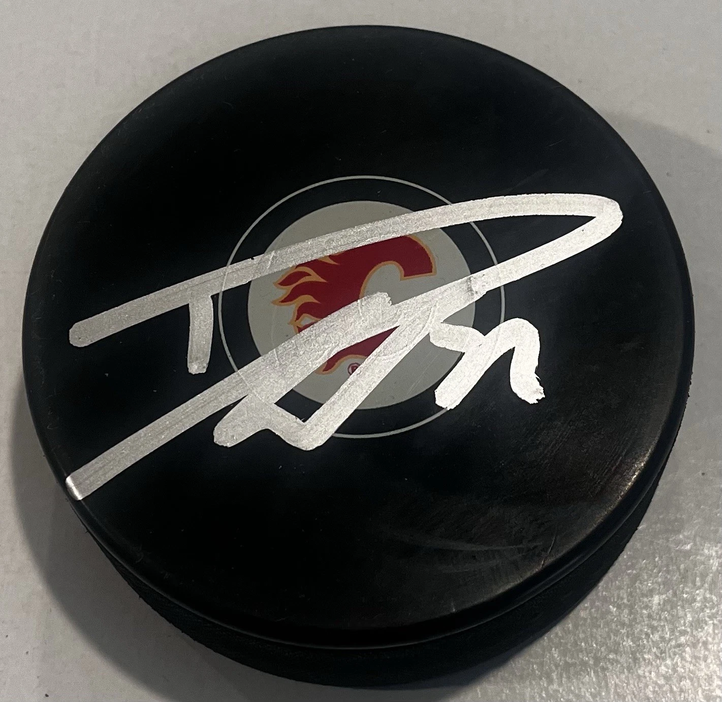 DUSTIN WOLF SIGNED CALGARY FLAMES HOCKEY PUCK W/ CASE COA