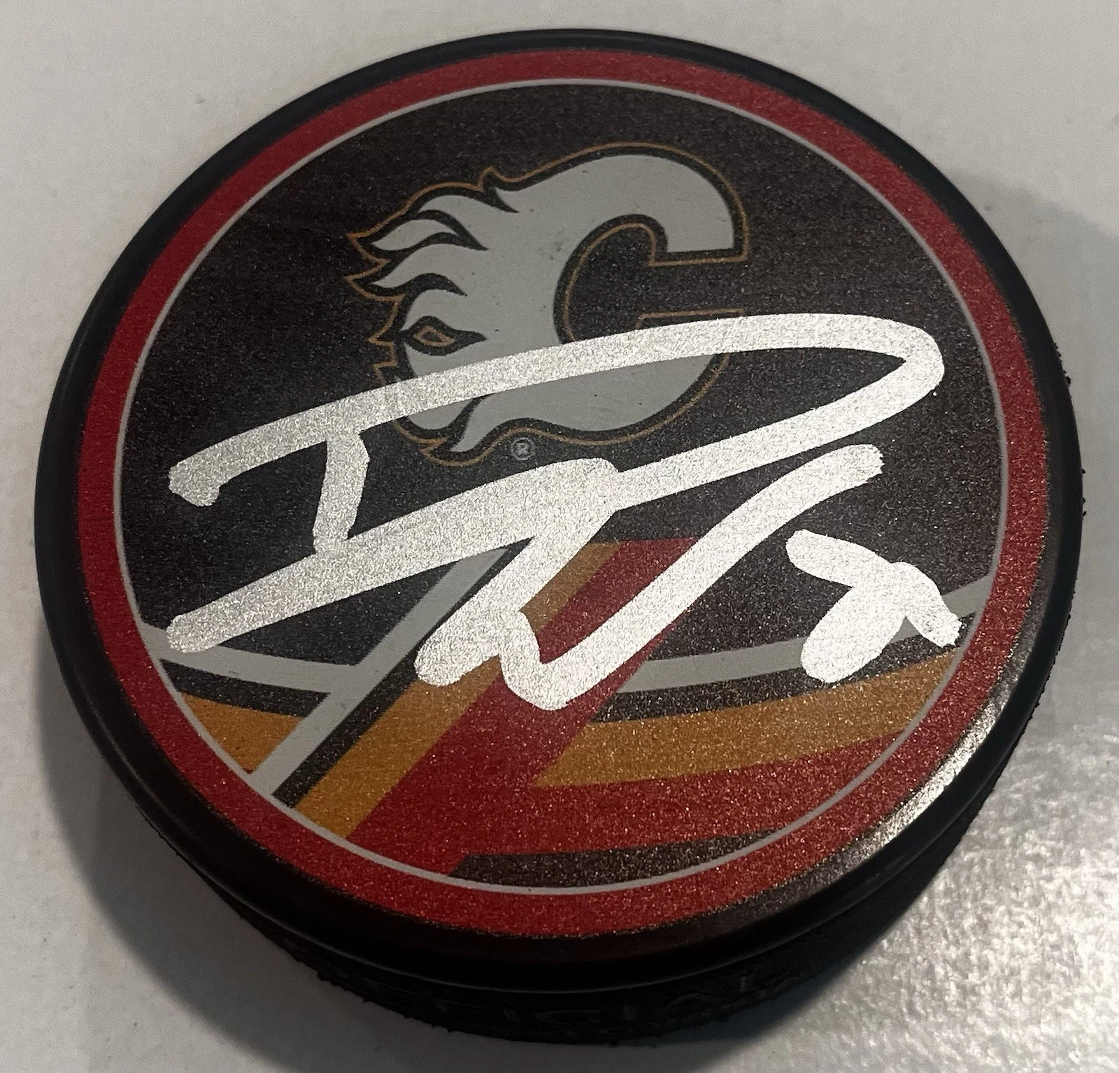 DUSTIN WOLF SIGNED CALGARY FLAMES HOCKEY PUCK W/ CASE COA
