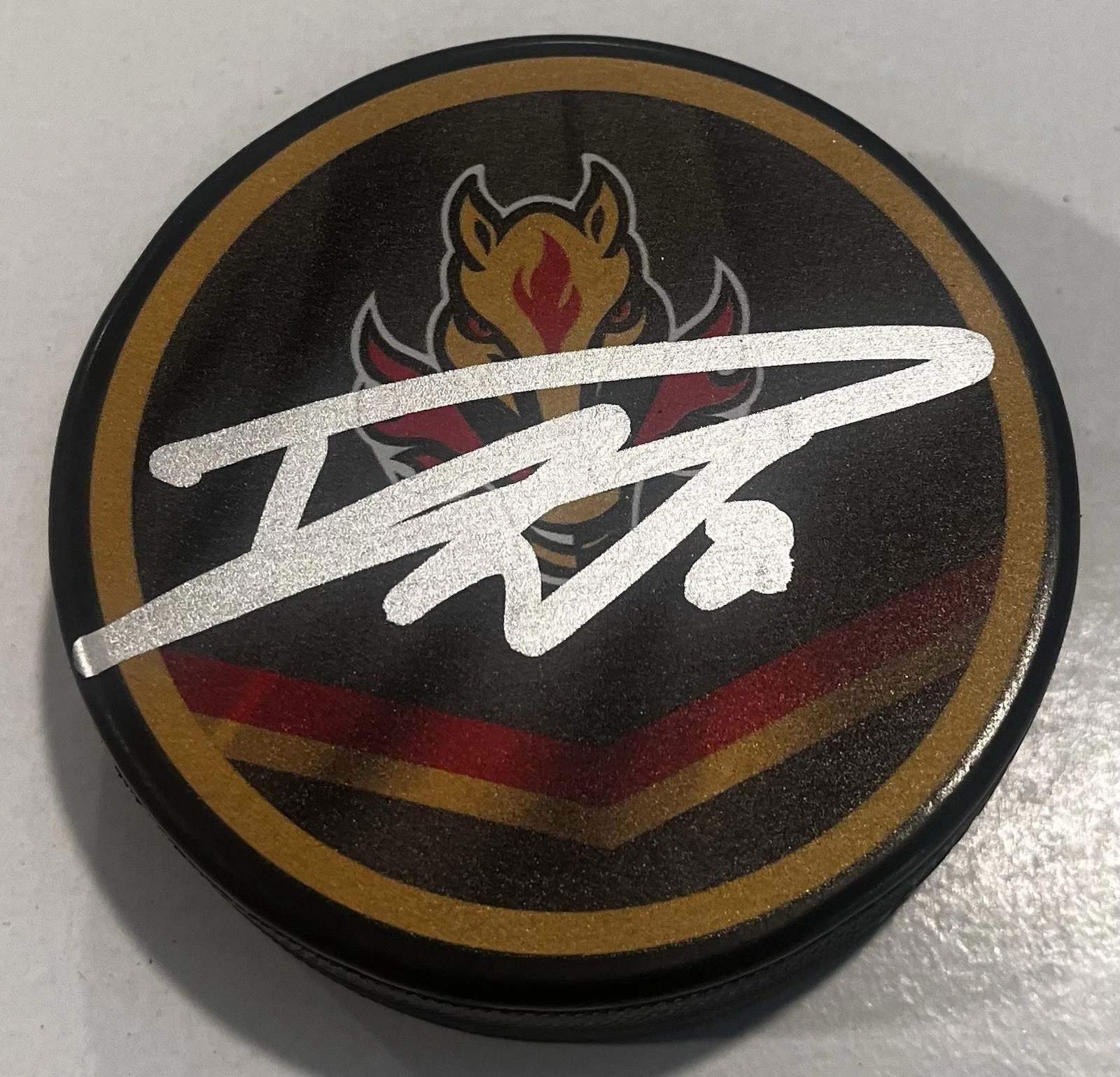 DUSTIN WOLF SIGNED CALGARY FLAMES HOCKEY PUCK W/ CASE COA