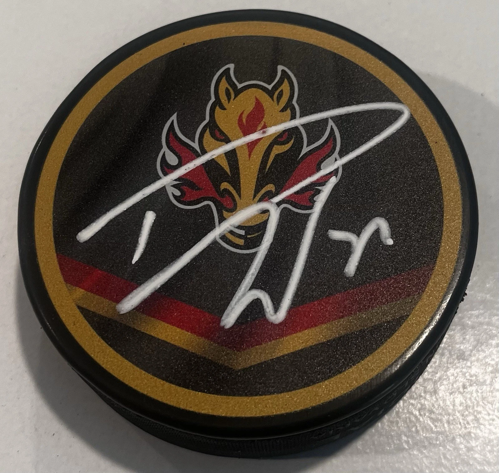 DUSTIN WOLF SIGNED CALGARY FLAMES HOCKEY PUCK W/ CASE COA