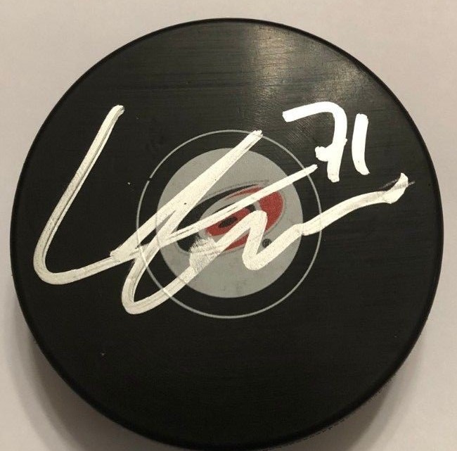 LUCAS WALLMARK SIGNED CAROLINA HURRICANES PUCK W/CASE COA