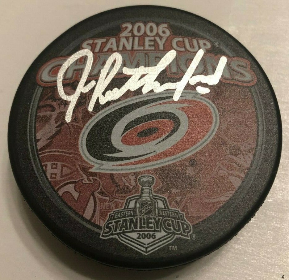 JIM RUTHERFORD SIGNED 2006 CAROLINA HURRICANES STANLEY CUP PUCK W/ CASE COA