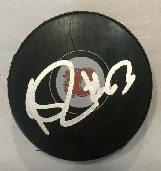 ADAM RUZICKA SIGNED CALGARY FLAMES HOCKEY PUCK W/ CASE COA