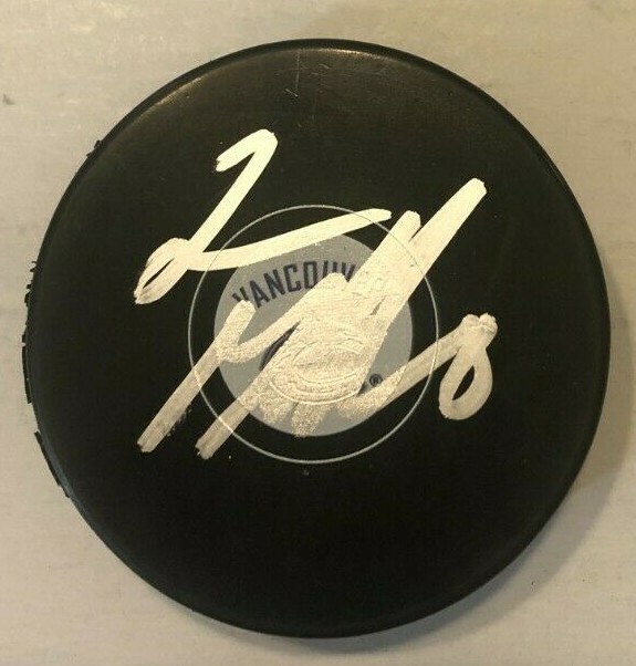 CONOR GARLAND SIGNED VANCOUVER CANUCKS HOCKEY PUCK W/ CASE COA