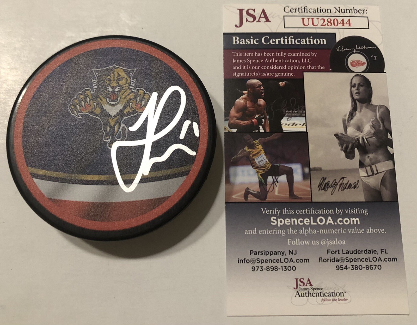JONATHAN HUBERDEAU SIGNED FLORIDA PANTHERS RETRO HOCKEY PUCK W/ CASE JSA COA