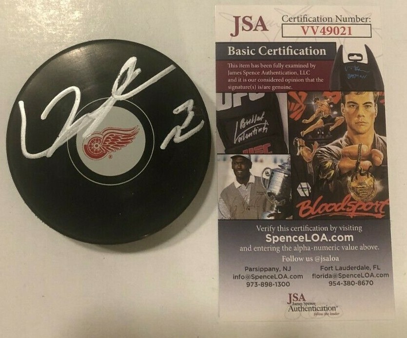LUCAS RAYMOND SIGNED DETROIT RED WINGS HOCKEY PUCK W CASE JSA COA