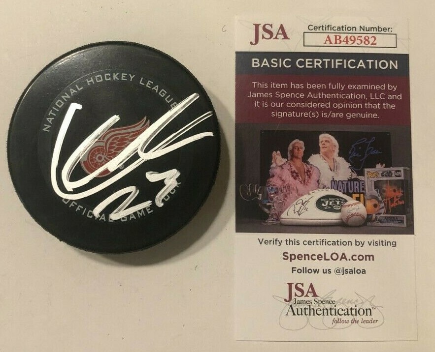 LUCAS RAYMOND SIGNED DETROIT RED WINGS OFFICIAL GAME HOCKEY PUCK W/ CASE JSA COA