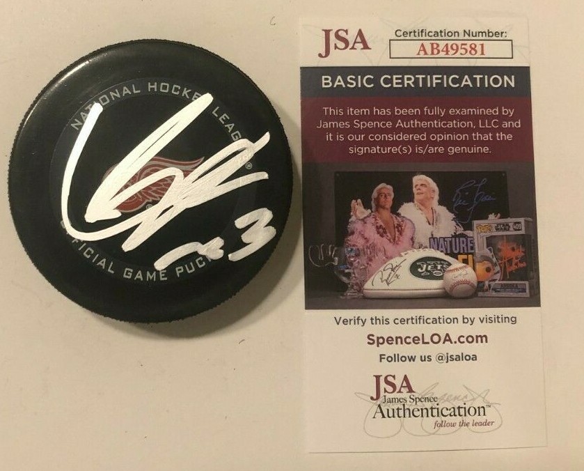 LUCAS RAYMOND SIGNED DETROIT RED WINGS OFFICIAL GAME HOCKEY PUCK W/ CASE JSA COA