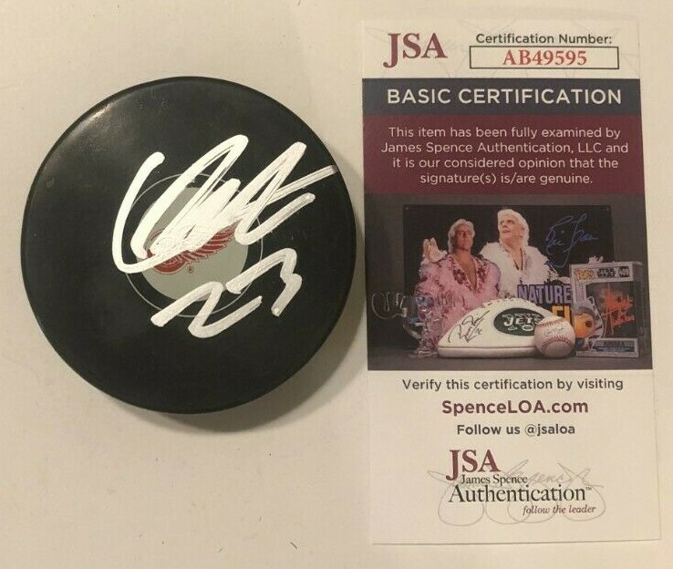 LUCAS RAYMOND SIGNED DETROIT RED WINGS HOCKEY PUCK W/ CASE JSA COA