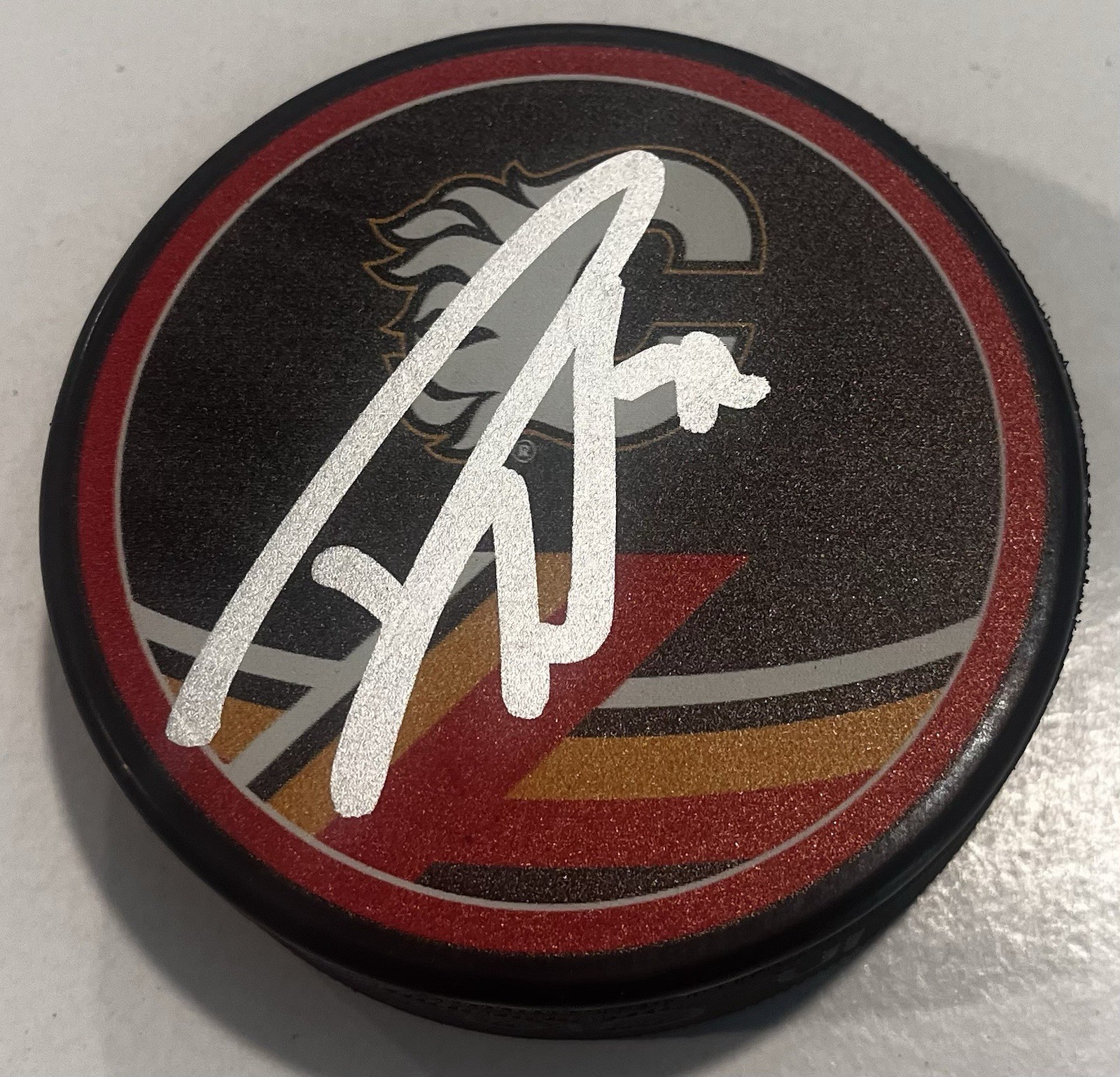 DUSTIN WOLF SIGNED CALGARY FLAMES HOCKEY PUCK W/ CASE COA