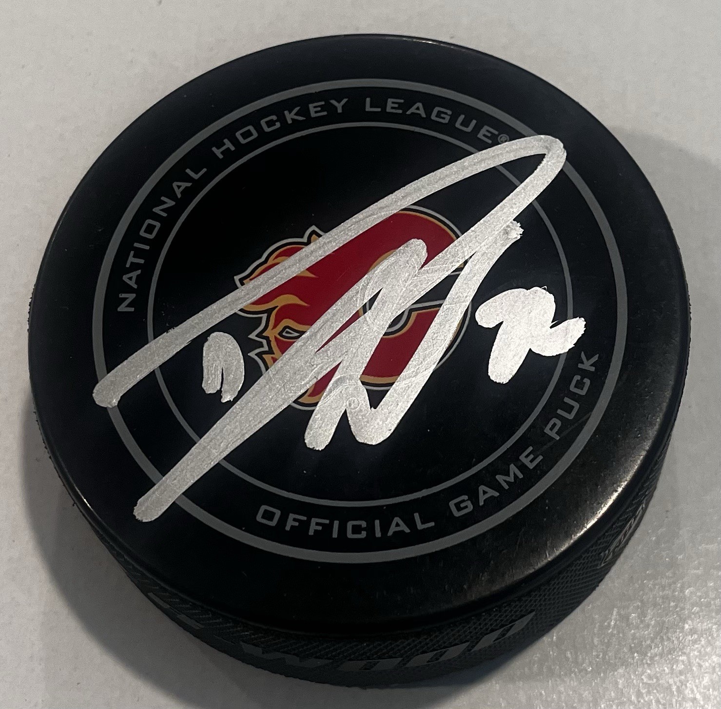 DUSTIN WOLF SIGNED CALGARY FLAMES GAME HOCKEY PUCK W/ CASE COA