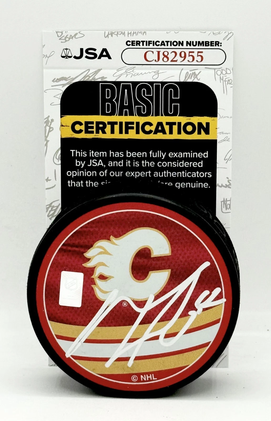 MacKenzie Weegar signed Calgary Flames Reverse Retro Puck autographed JSA