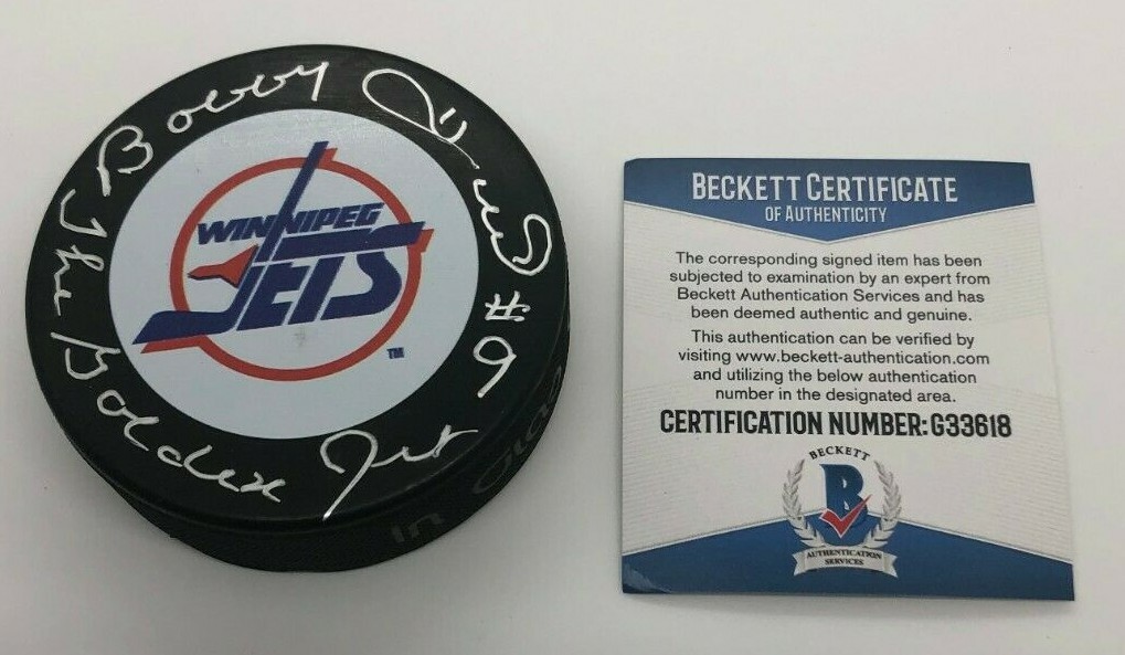 BOBBY HULL SIGNED WINNIPEG JETS HOCKEY PUCK W/ CASE THE GOLDEN JET BECKETT BAS