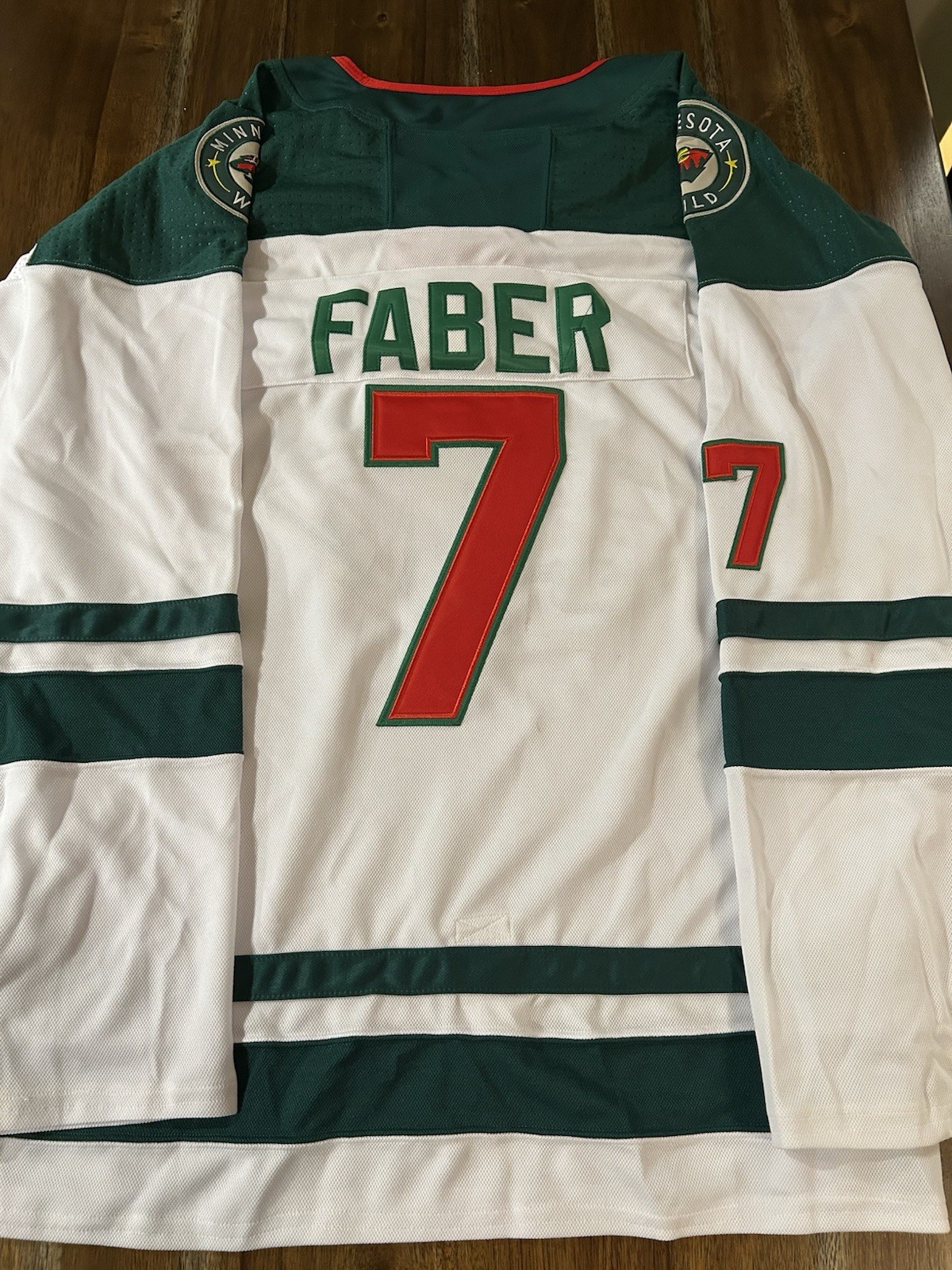 BROCK FABER ‘MN WILD’ STITCHED JERSEY SIZE 52 MENS L BRAND NEW COLLECTIBLE MEMORABILIA