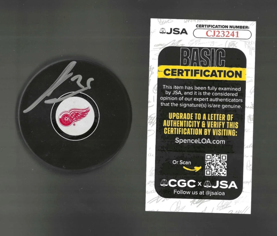 James van Riemsdyk Signed Detroit Red Wings Puck JSA COA