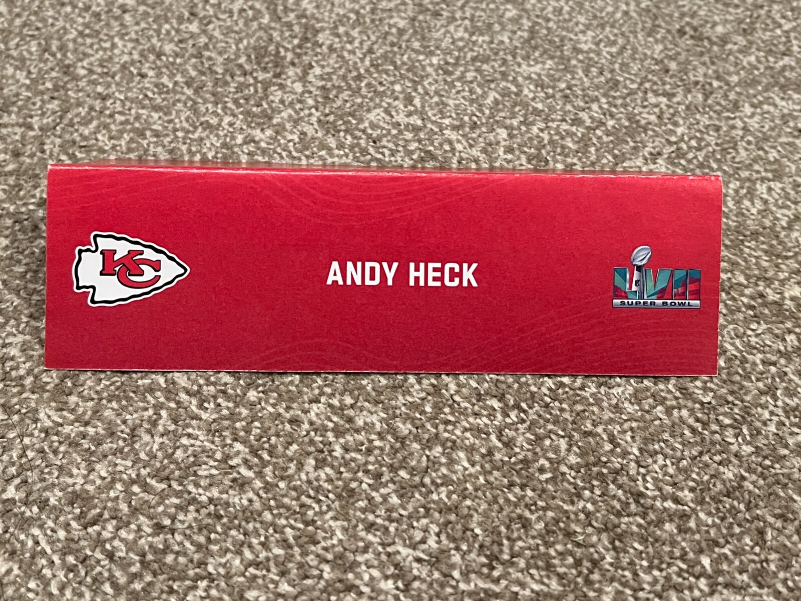 KANSAS CITY CHIEFS TEAM ISSUED SUPER BOWL LVII PAPER NAMEPLATE ANDY HECK