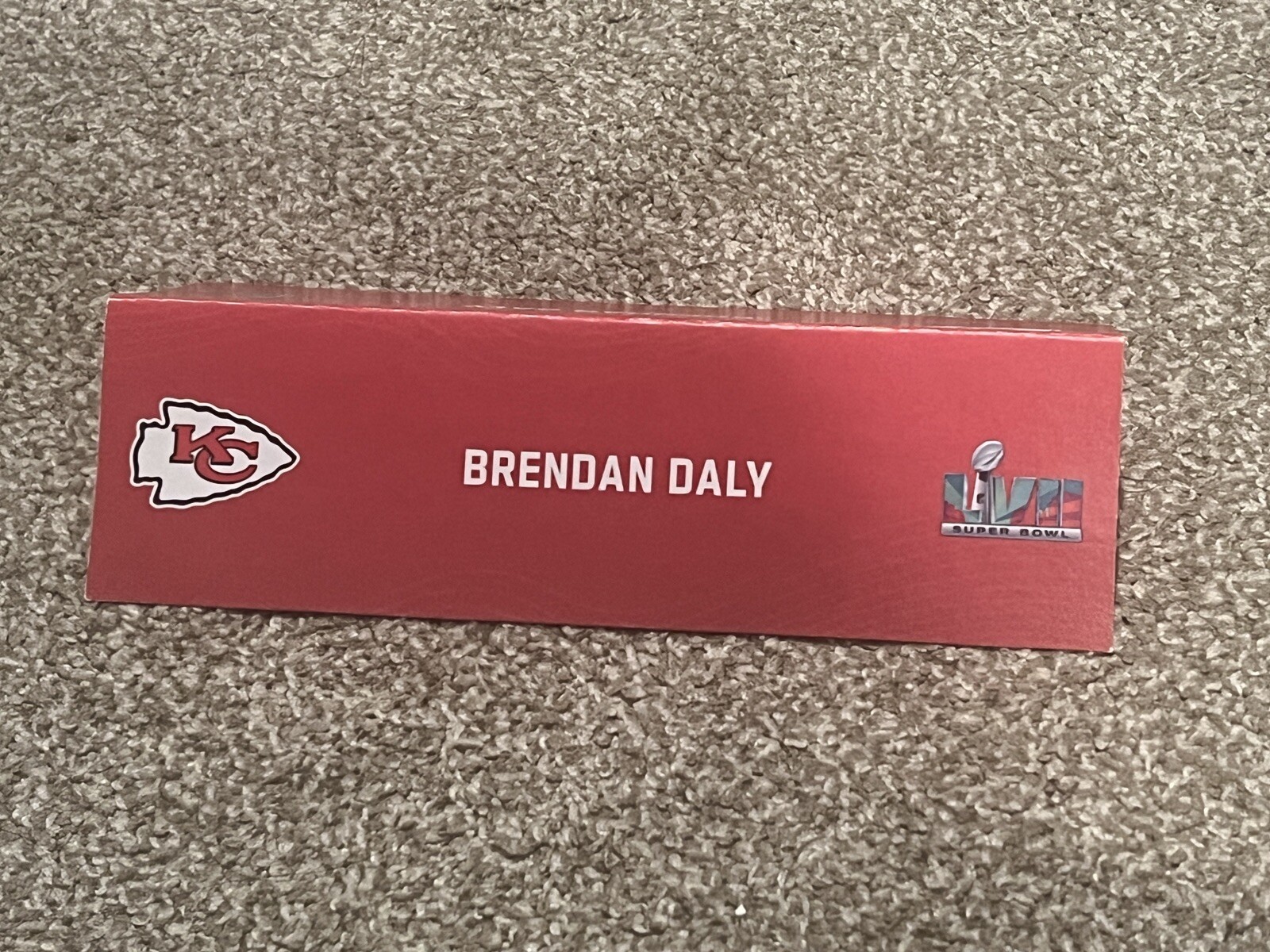 KANSAS CITY CHIEFS TEAM ISSUED SUPER BOWL LVII PAPER NAMEPLATE BRENDAN DALY