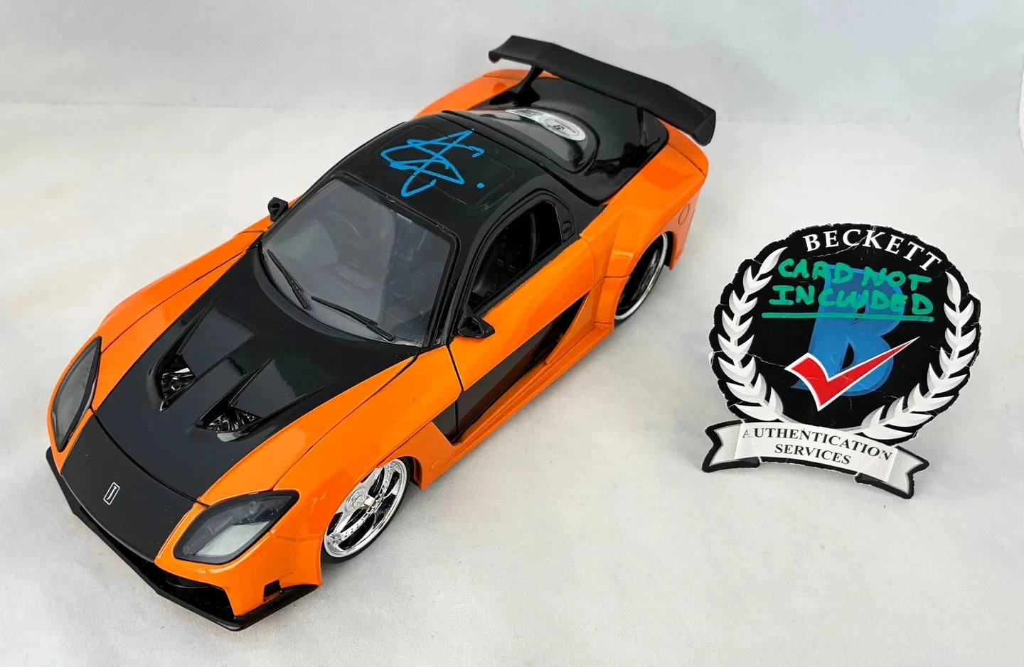 SUNG KANG SIGNED DIECAST CAR 1:24 FAST AND THE FURIOUS HAN LUE BECKETT BAS COA COLLECTIBLE MEMORABILIA