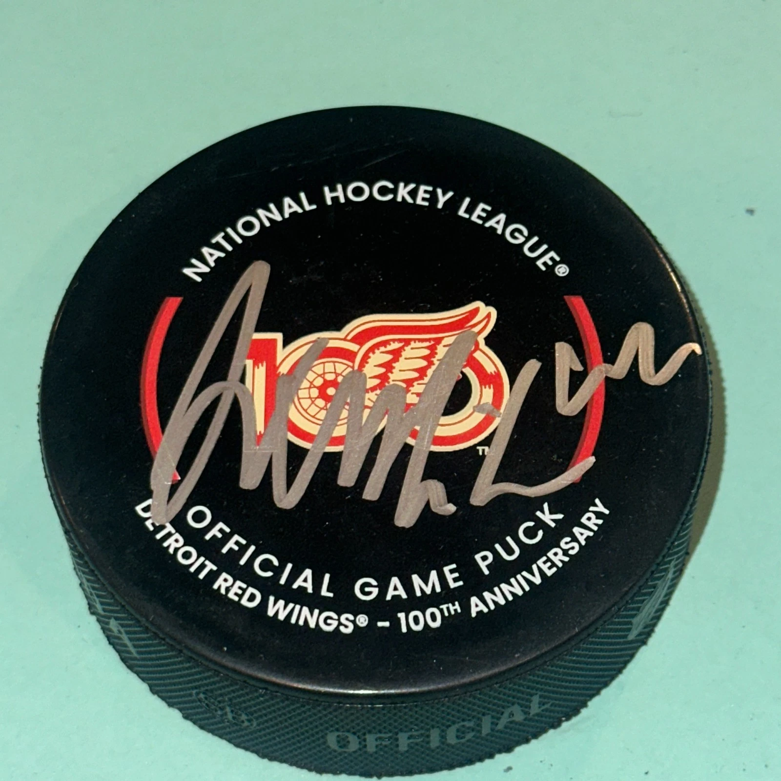 AXEL SANDIN-PELLIKKA Signed RED WINGS 100th Official GAME Puck Beckett (BAS)