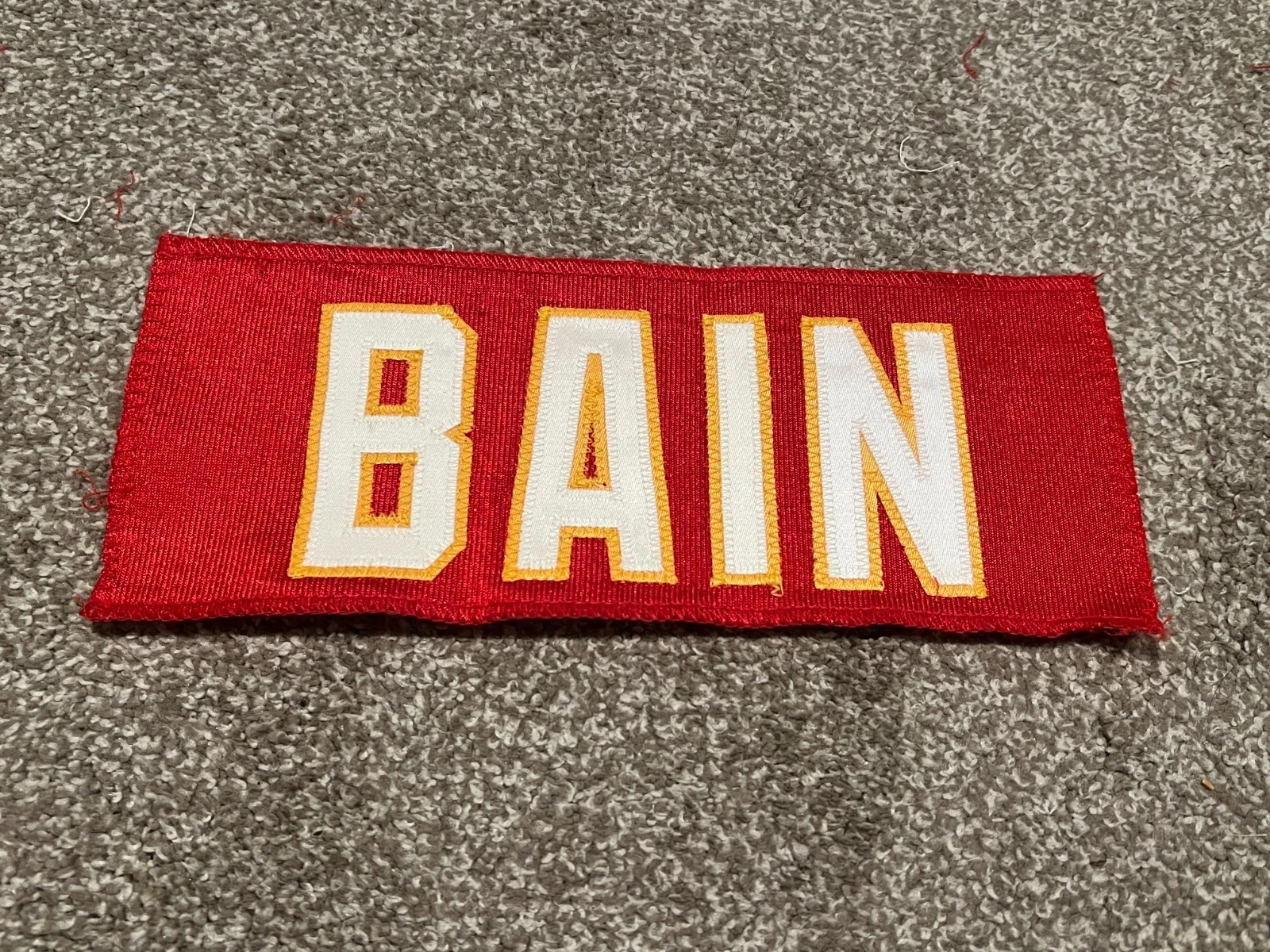 KANSAS CITY CHIEFS GAME USED ? TEAM ISSUED JERSEY NAMEPLATE FOOTBALL BAIN