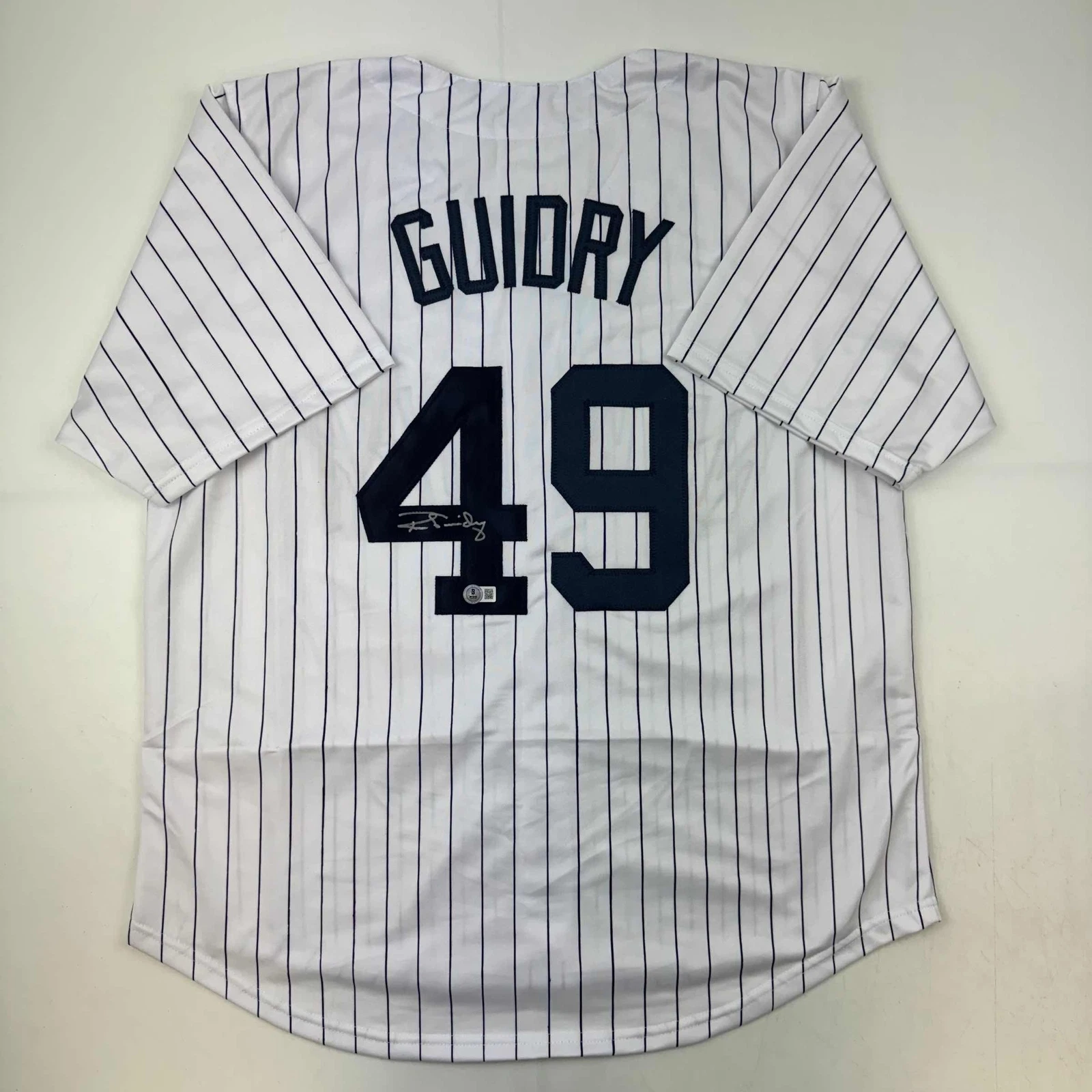 Autographed/Signed Ron Guidry New York Pinstripe Baseball Jersey Beckett BAS COA