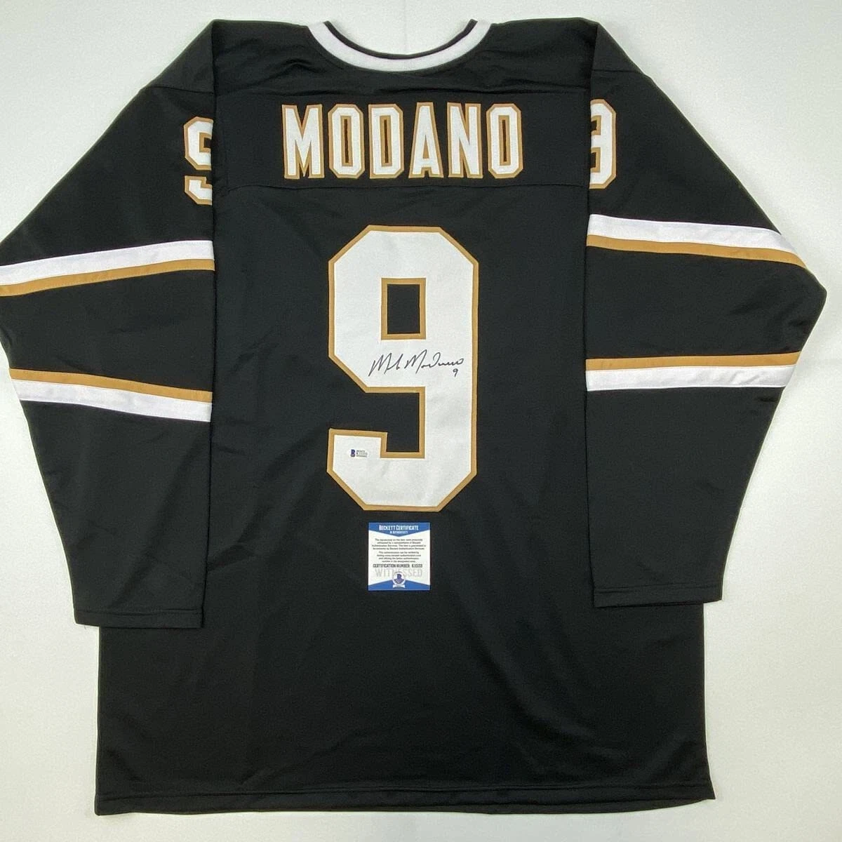 Autographed/Signed Mike Modano Dallas Black Hockey Jersey Beckett BAS COA
