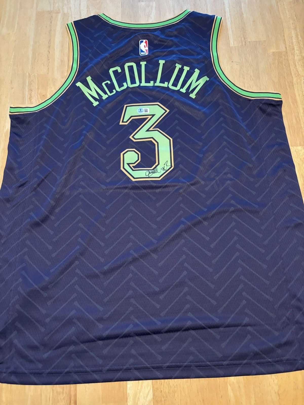 C.J. MCCOLLUM SIGNED AUTOGRAPHED NEW ORLEANS PELICANS JERSEY. Beckett Coa