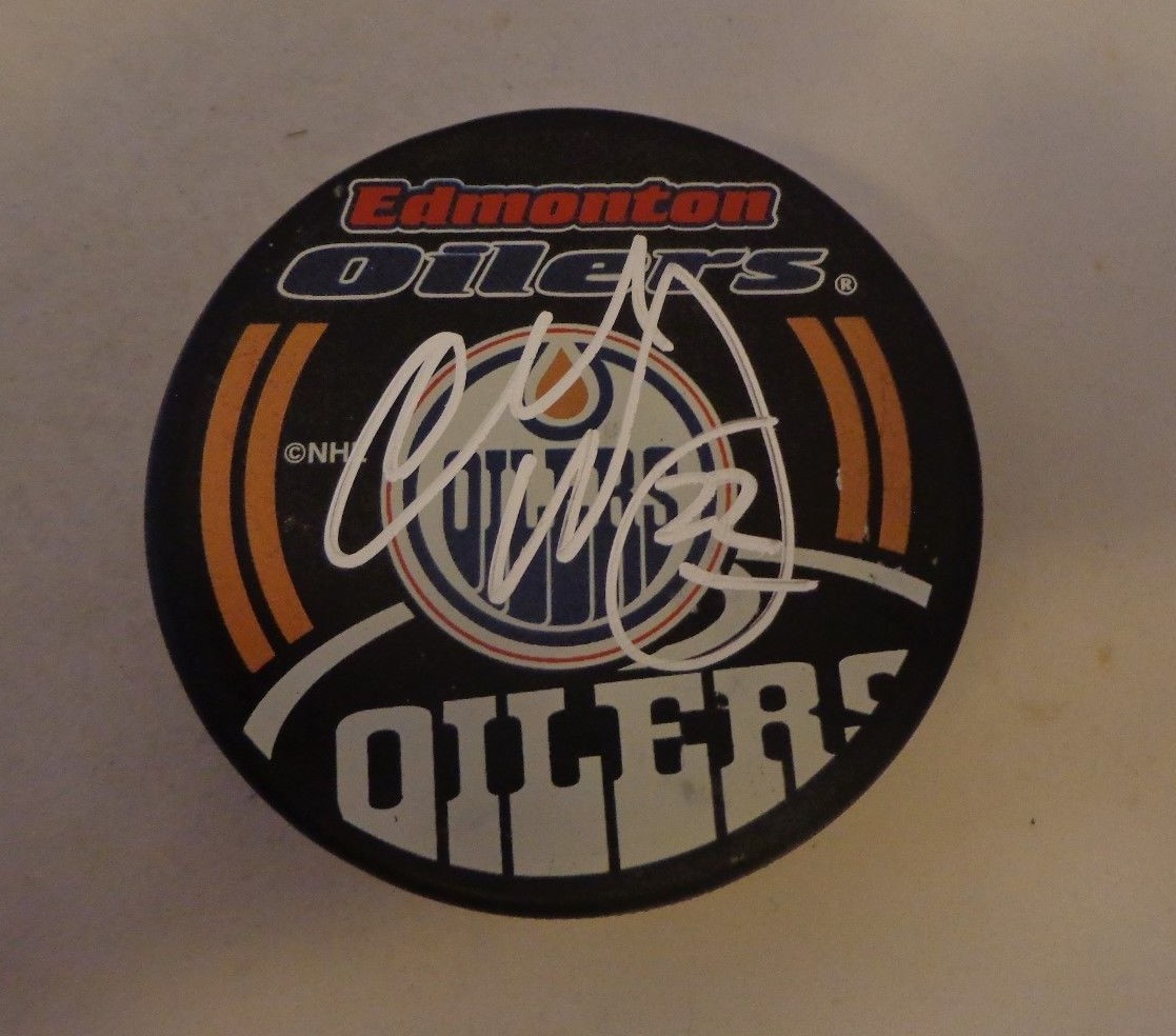 Charlie Huddy signed Edmonton Oilers puck autographed