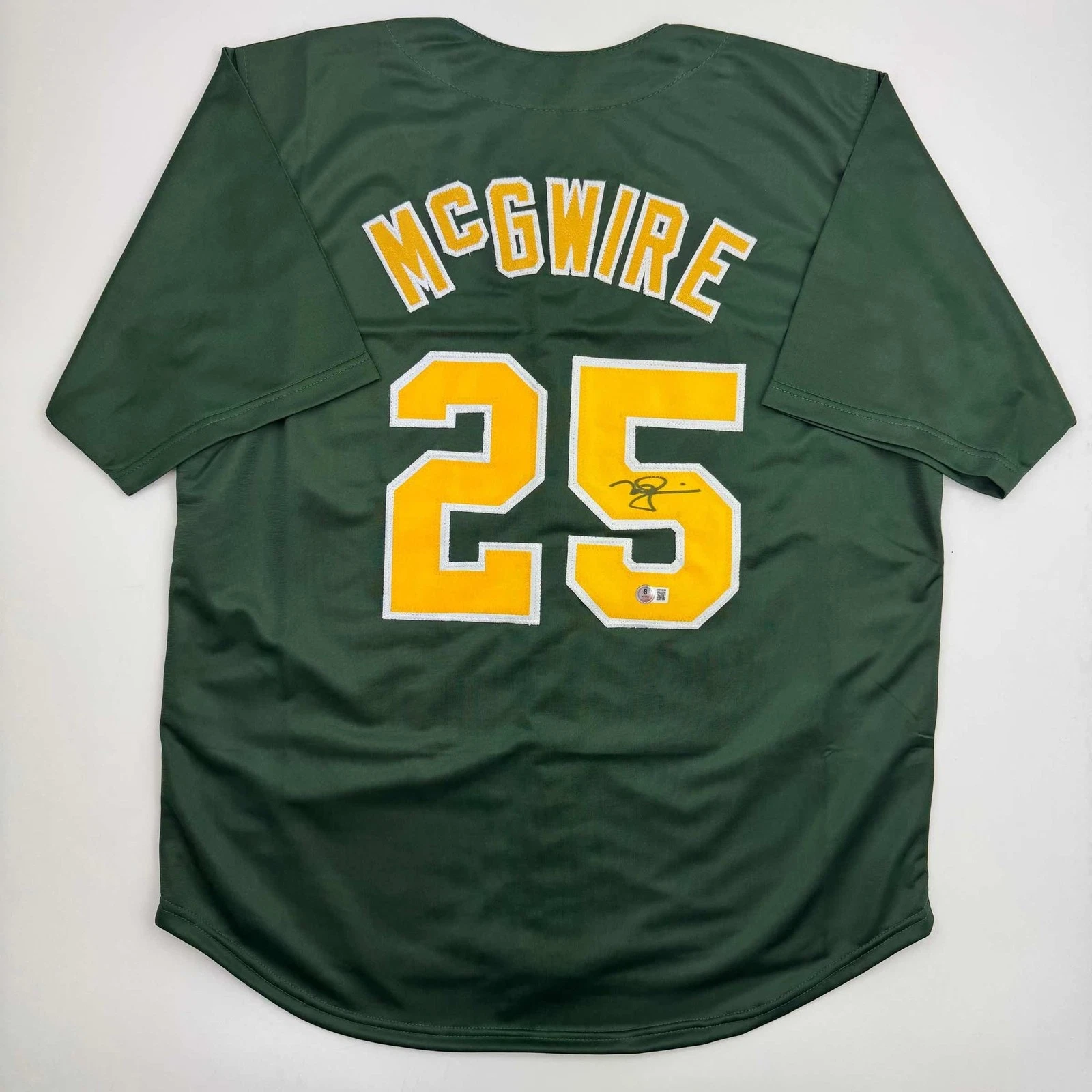 Autographed/Signed Mark McGwire Oakland Green Jersey Beckett BAS COA