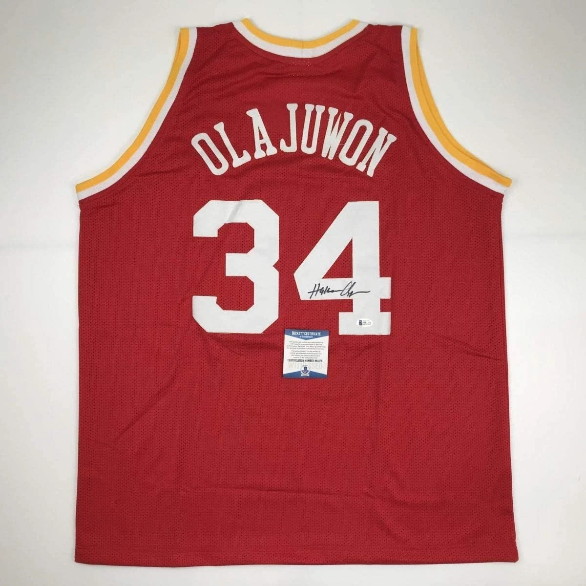 Autographed/Signed Hakeem Olajuwon Houston Red Jersey Beckett COA