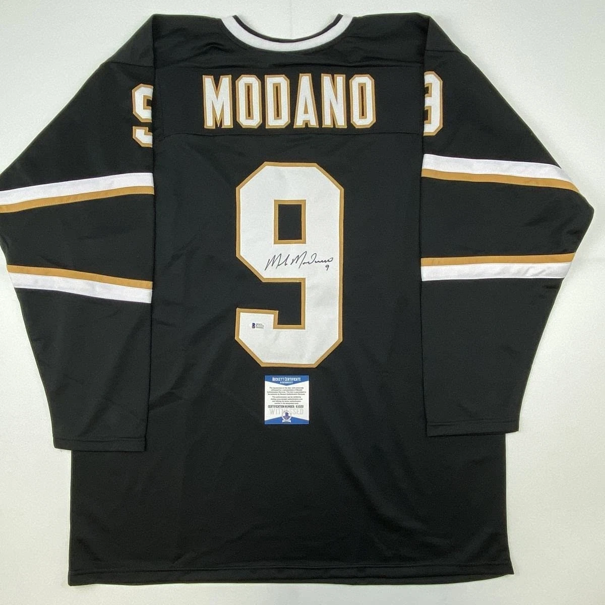 Autographed/Signed Mike Modano Dallas Black Hockey Jersey Beckett BAS COA